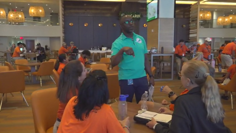 Miami Dade College professor finds his passion with side job at Hard Rock Stadium — CBS Miami, Irving Arts news